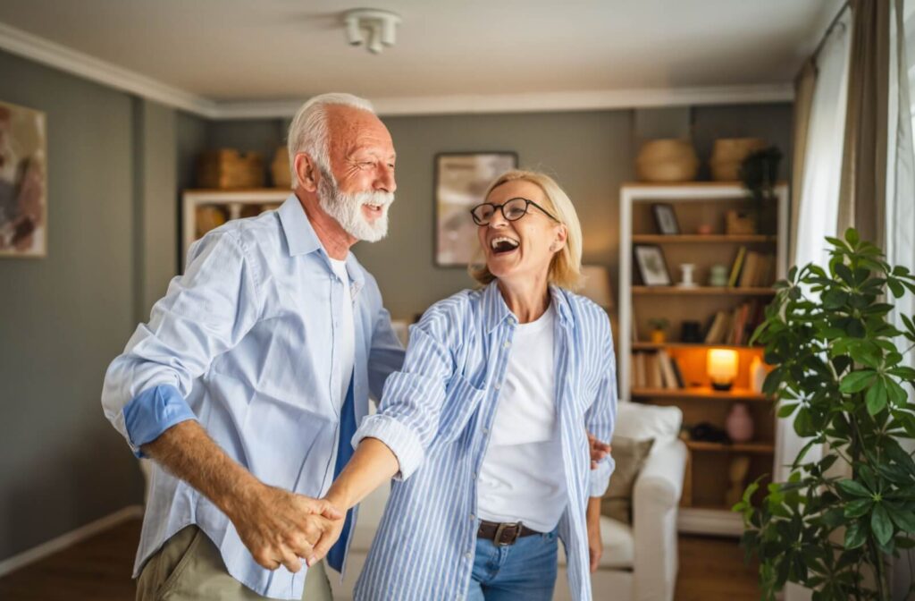 A senior couple playfully interacting with each other during a respite care stay, enjoying the freedom it offers them
